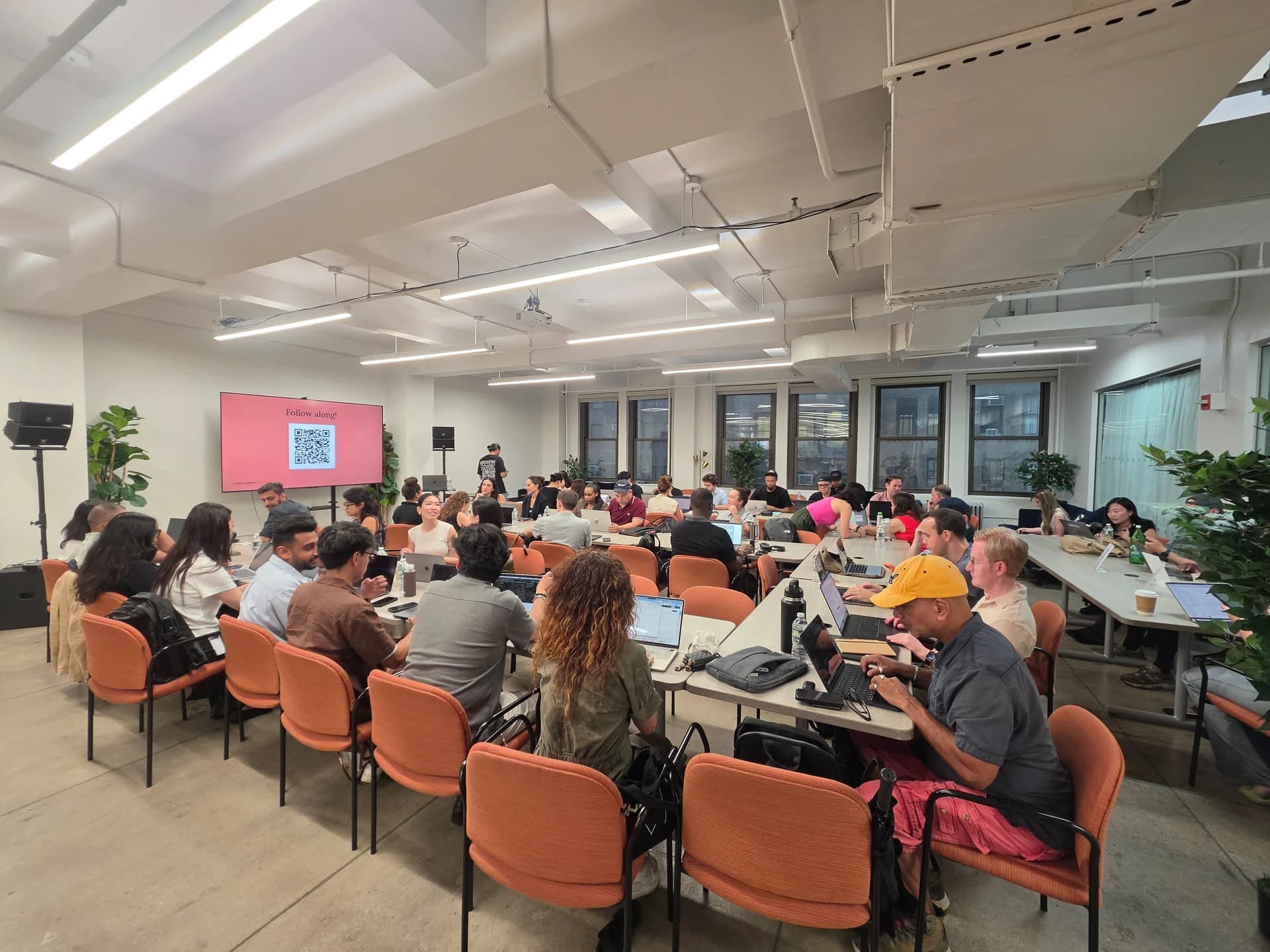 Attendees building along on laptops during a Time Rich Club workshop